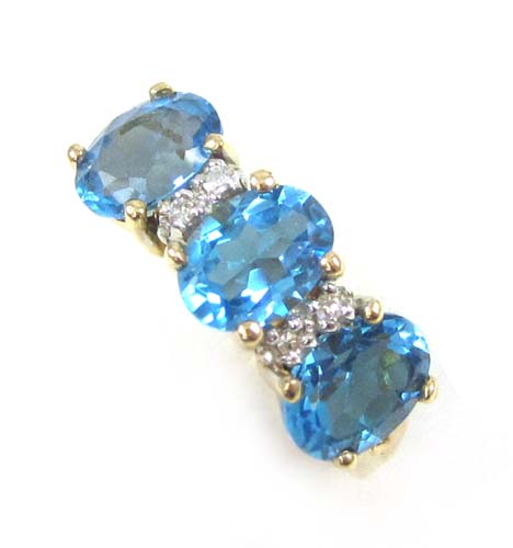 Appraisal: BLUE TOPAZ DIAMOND AND FOURTEEN KARAT GOLD RING set with