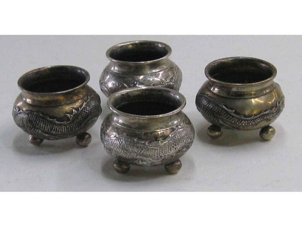 Appraisal: Set of four oriental white metal salts with dragon decoration