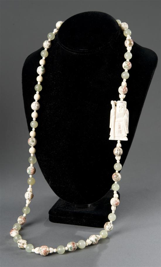 Appraisal: Chinese ivory and serpentine necklace st half th century Having