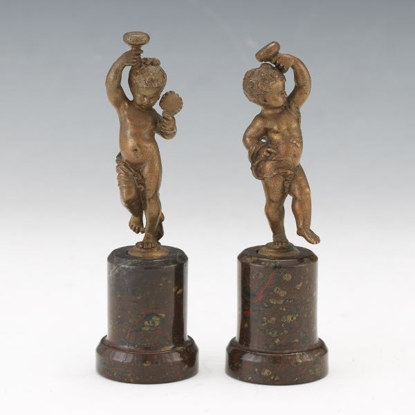 Appraisal: PAIR OF GRAND TOUR CABINET FIGURINES OF CHERUBS ON PEDESTALS