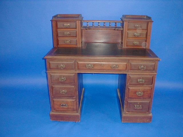 Appraisal: A late Victorian mahogany kneehole desk with drawer and gallery