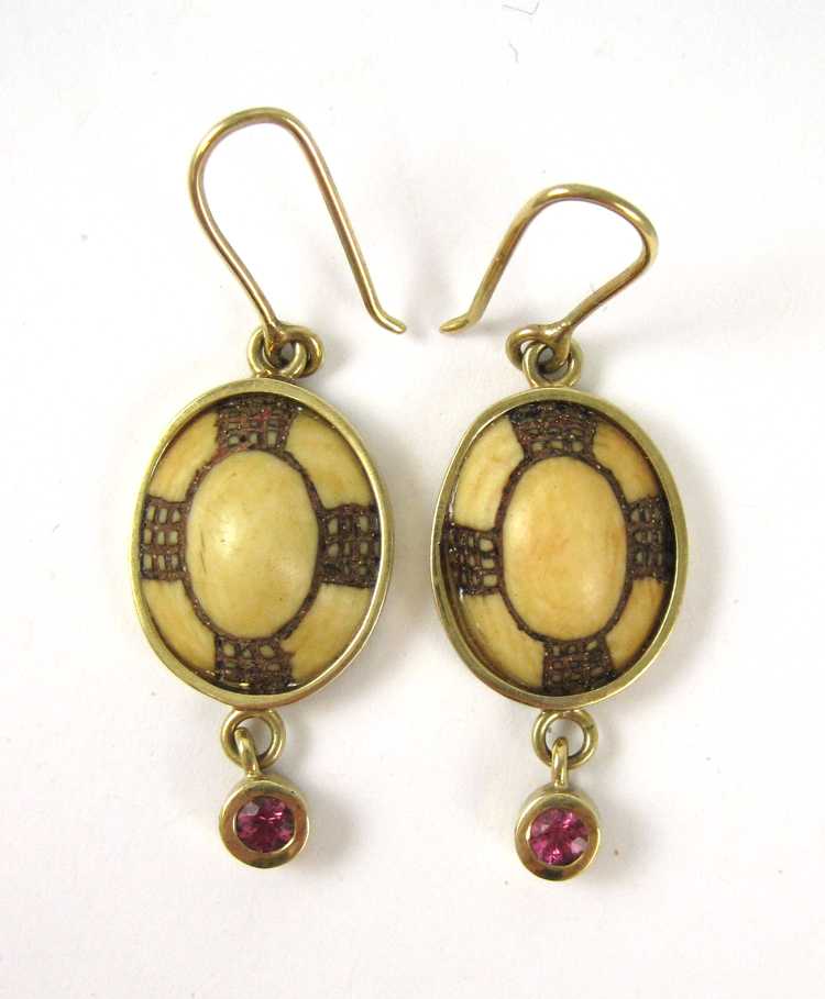 Appraisal: PAIR OF PINK SAPPHIRE AND INCISED BONE EARRINGS each with