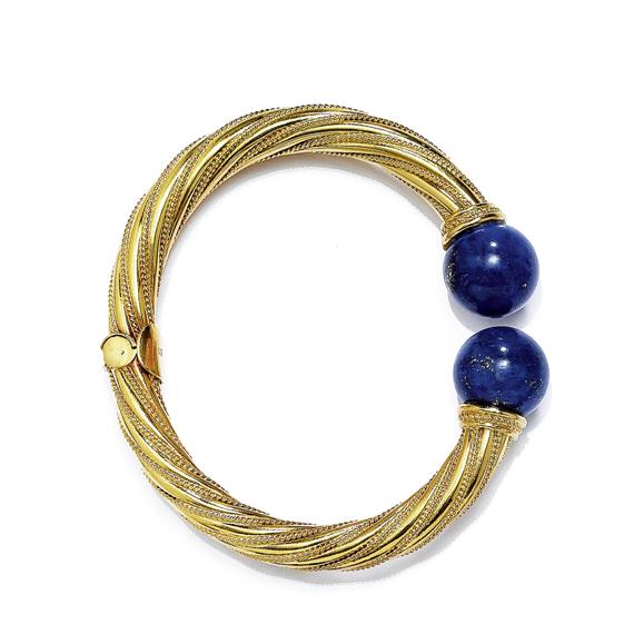 Appraisal: A GOLD AND LAPIS LAZULI BANGLE circa Yellow gold total