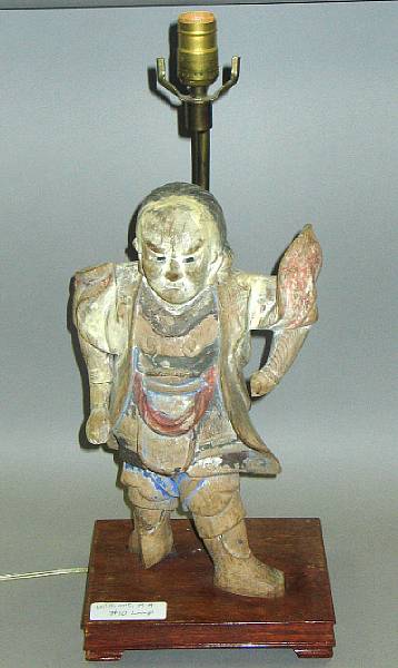 Appraisal: A polychrome painted wood standing guardian figure with glass-inlaid eyes