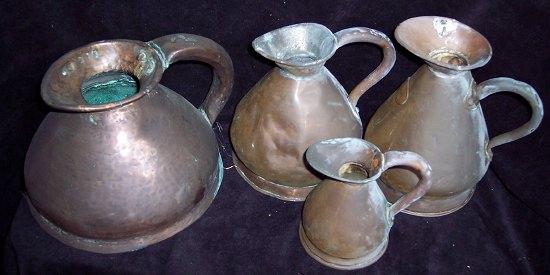 Appraisal: A heavy copper jug of squat form two copper quart