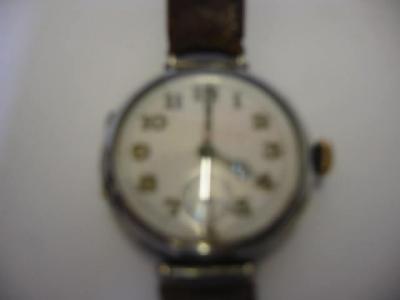 Appraisal: A GENTLEMAN'S WRIST WATCH in silver case the white enamel