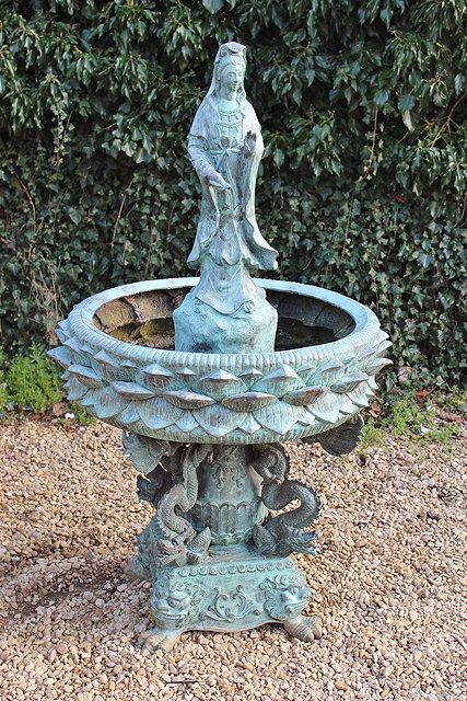 Appraisal: AN ORIENTAL STYLE BRONZE FOUNTAIN centrally mounted with a figure