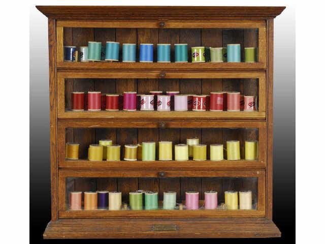 Appraisal: Ribbon Cabinet With Spools Description Wood and glass A N