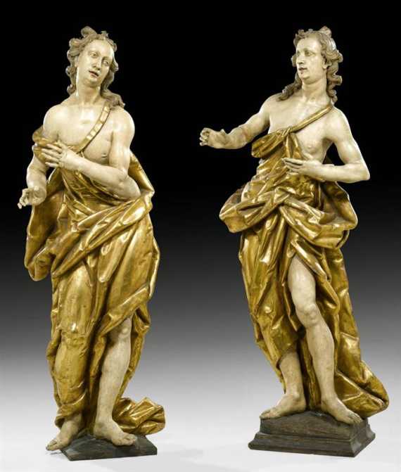 Appraisal: PAIR OF ANGELS Austria mid th century Carved wood with