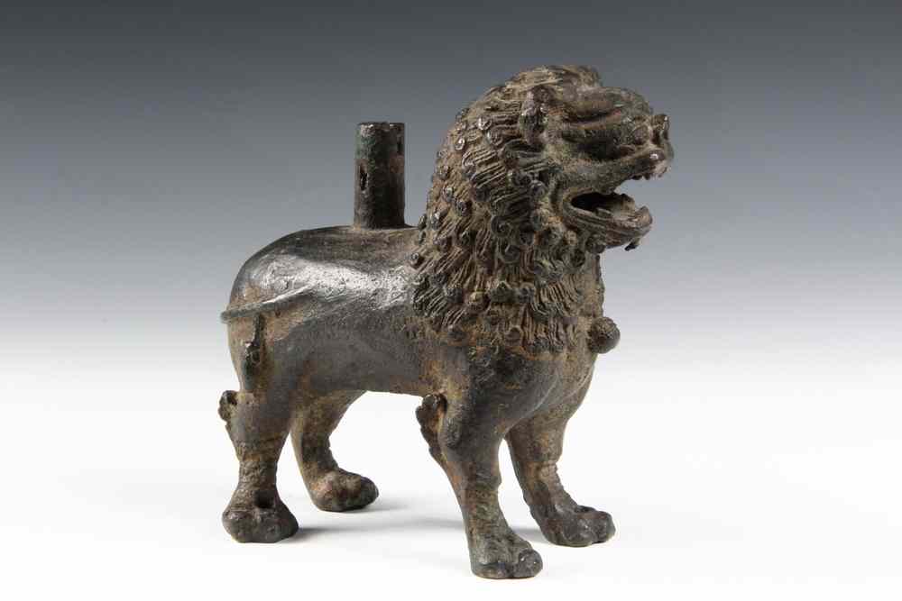 Appraisal: EARLY BRONZE STANDING LION - probably Chinese finely cast with