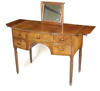 Appraisal: A mahogany bowfront washstand inlaid stringing with a hinged panel