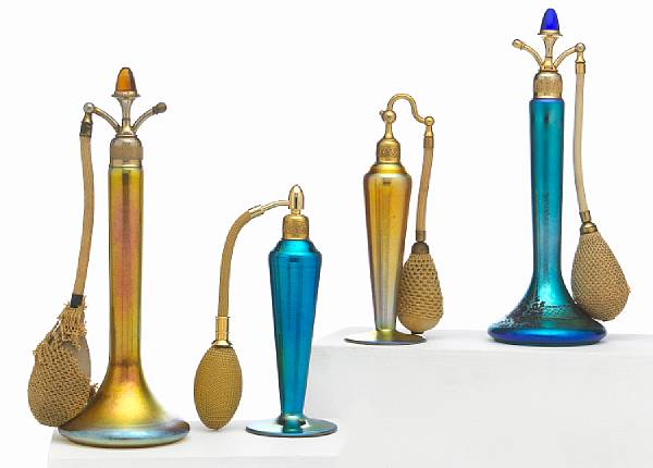 Appraisal: Four Steuben gilt-metal-mounted Aurene glass atomizers shape ' and -