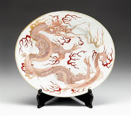 Appraisal: Japanese iron-red decorated porcelain 'dragon' platter six character marks to