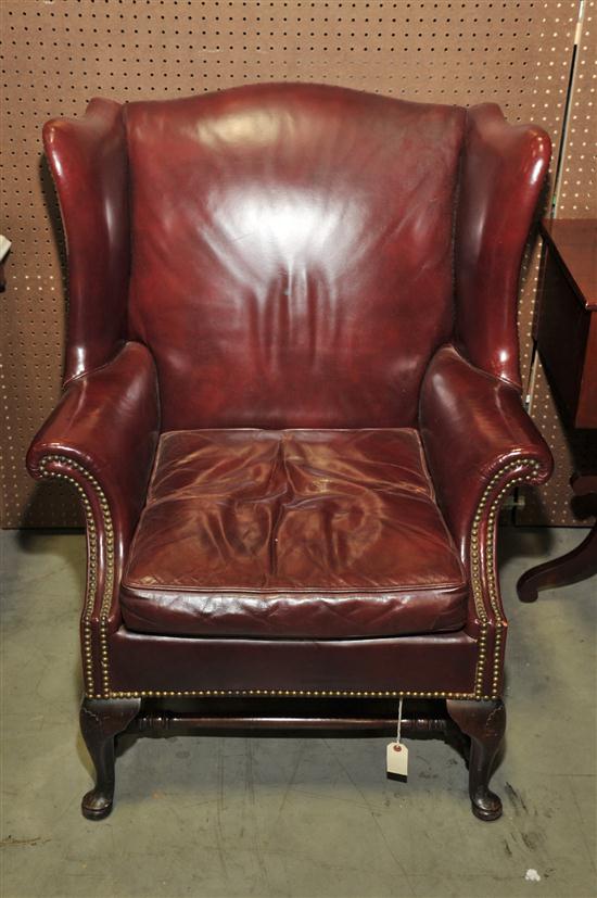 Appraisal: EGELHOFF'S LEATHER ARMCHAIR Red leather wingback chair with brass tacks