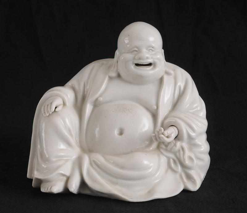 Appraisal: CHINESE DEHUA PORCELAIN FIGURE OF A SEATED BUDDHA Modeled smiling