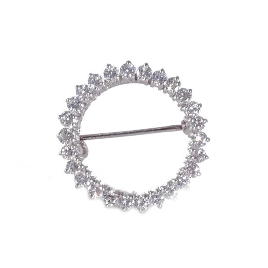 Appraisal: Diamond and gold circle brooch twenty-six mm round diamonds weighing