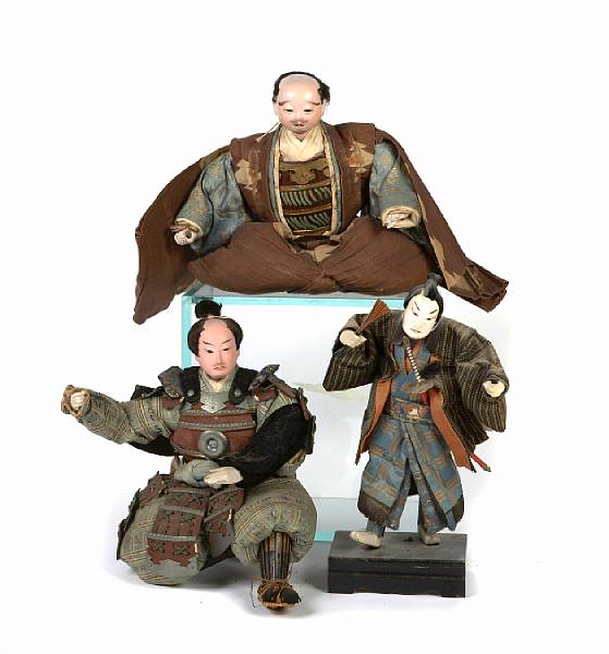 Appraisal: Eight Japanese ningyos dolls including two musha-ningyos warrior dolls and