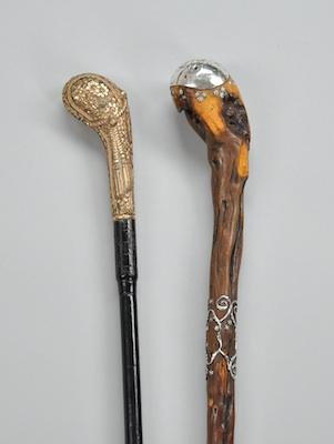 Appraisal: Two Club Shape Walking Sticks First an ebony walking stick