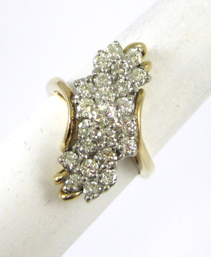 Appraisal: DIAMOND AND FOURTEEN KARAT GOLD RING featuring a waterfall cluster