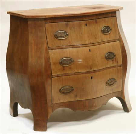 Appraisal: A th century mahogany bombe commode the serpentine top over