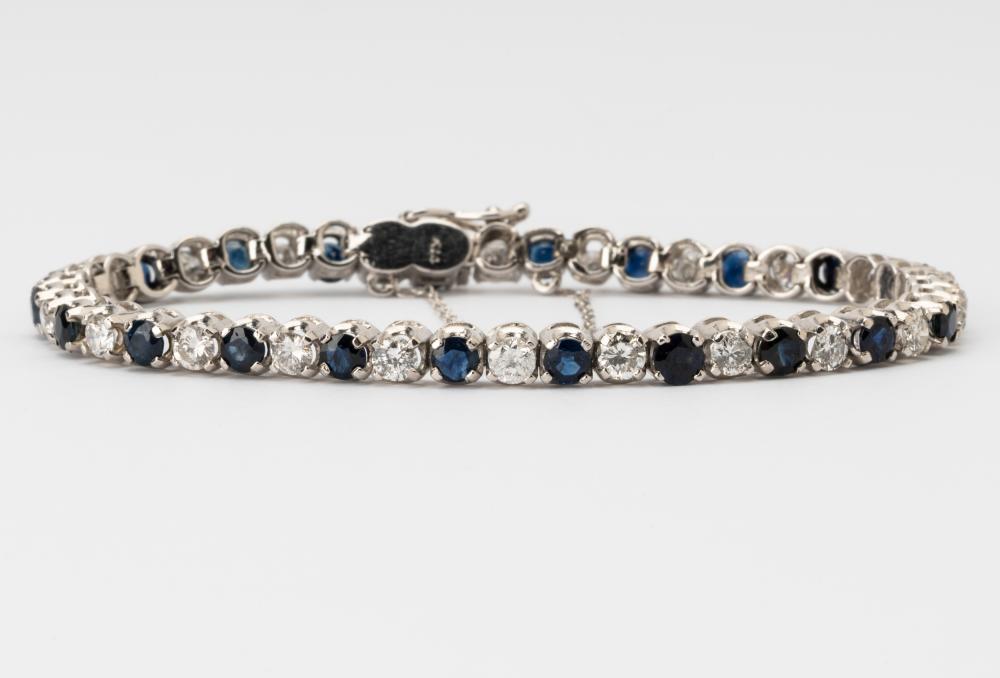 Appraisal: KARAT WHITE GOLD DIAMOND SAPPHIRE LINE BRACELETThe bracelet prong set