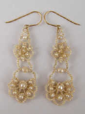 Appraisal: A pair of seed pearl drop earrings approx cm drop