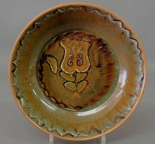 Appraisal: Stahl Pottery redware deep dish with tulip decoration the reverse