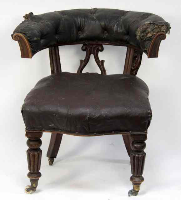 Appraisal: A Victorian mahogany tub chair with leather upholstered back and