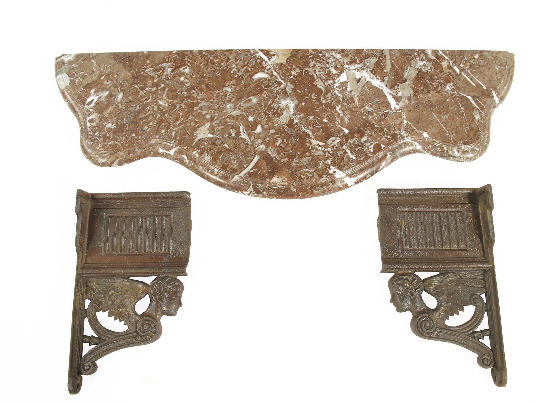 Appraisal: A pair of cast iron wall brackets