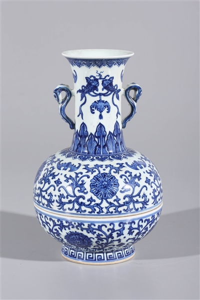 Appraisal: Chinese blue and white porcelain two-piece vase with molded handles