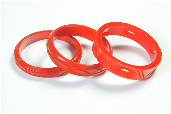 Appraisal: THREE BAKELITE BRACELETS American Ca - Three red carved Bakelite