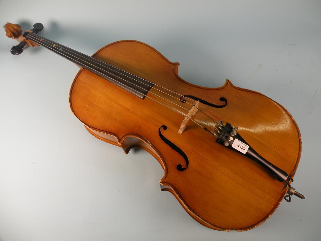 Appraisal: A Hungarian students cello with a carved scroll and ebonised