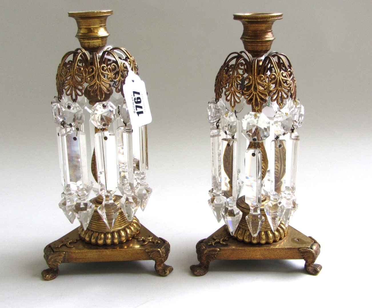 Appraisal: A pair of Regency style gilt bronze lustre candlesticks the