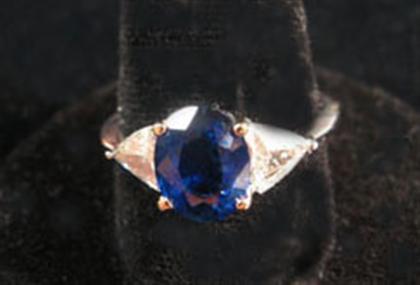 Appraisal: Sapphire and diamond ring Oval cut sapphire framed on either