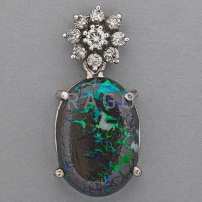 Appraisal: BLACK MATRIX OPAL AND DIAMOND PENDANT Oval opal specimen x