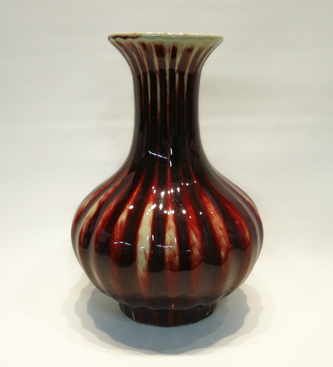 Appraisal: CHINESE PORCELAIN FLAMBE GLAZED VASE bottle form having lobed sides