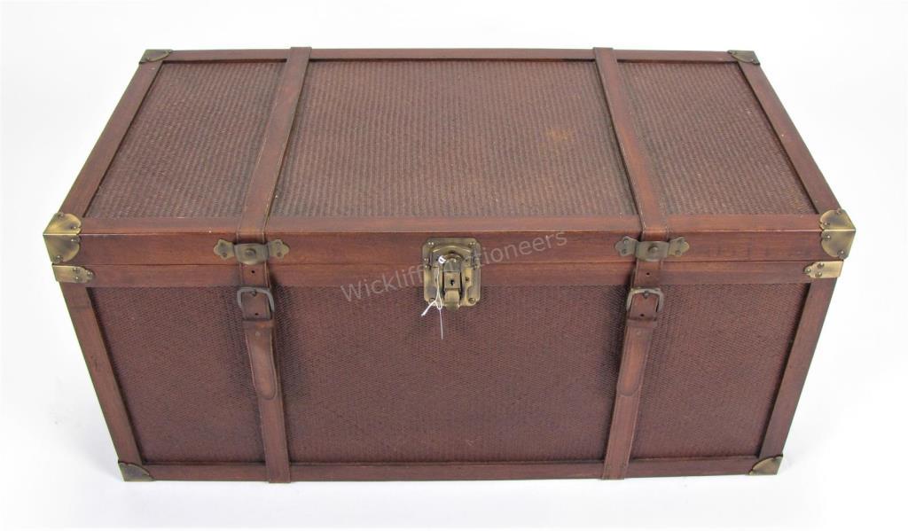 Appraisal: A decorator wooden trunk brass corner caps leather straps locking