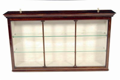 Appraisal: A mahogany hanging display cabinet with a Greek key cornice