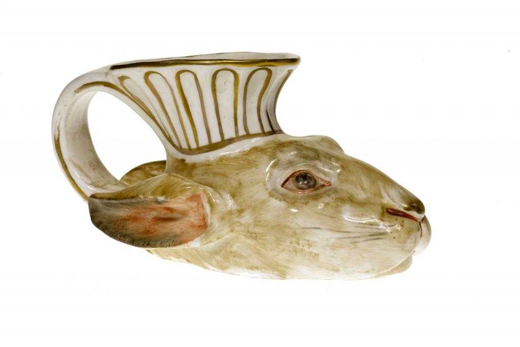 Appraisal: AN ENGLISH PORCELAIN HARE'S HEAD STIRRUP CUP of Rhyton form