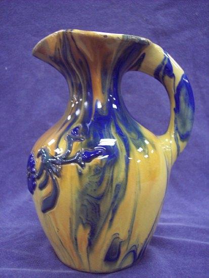 Appraisal: An Elton pottery jug of mottled yellow and blue ground