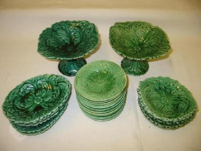 Appraisal: TWO VICTORIAN GREEN MAJOLICA COMPORTS moulded as layered leaves on