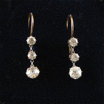 Appraisal: A pair of late Victorian diamond earrings each with three