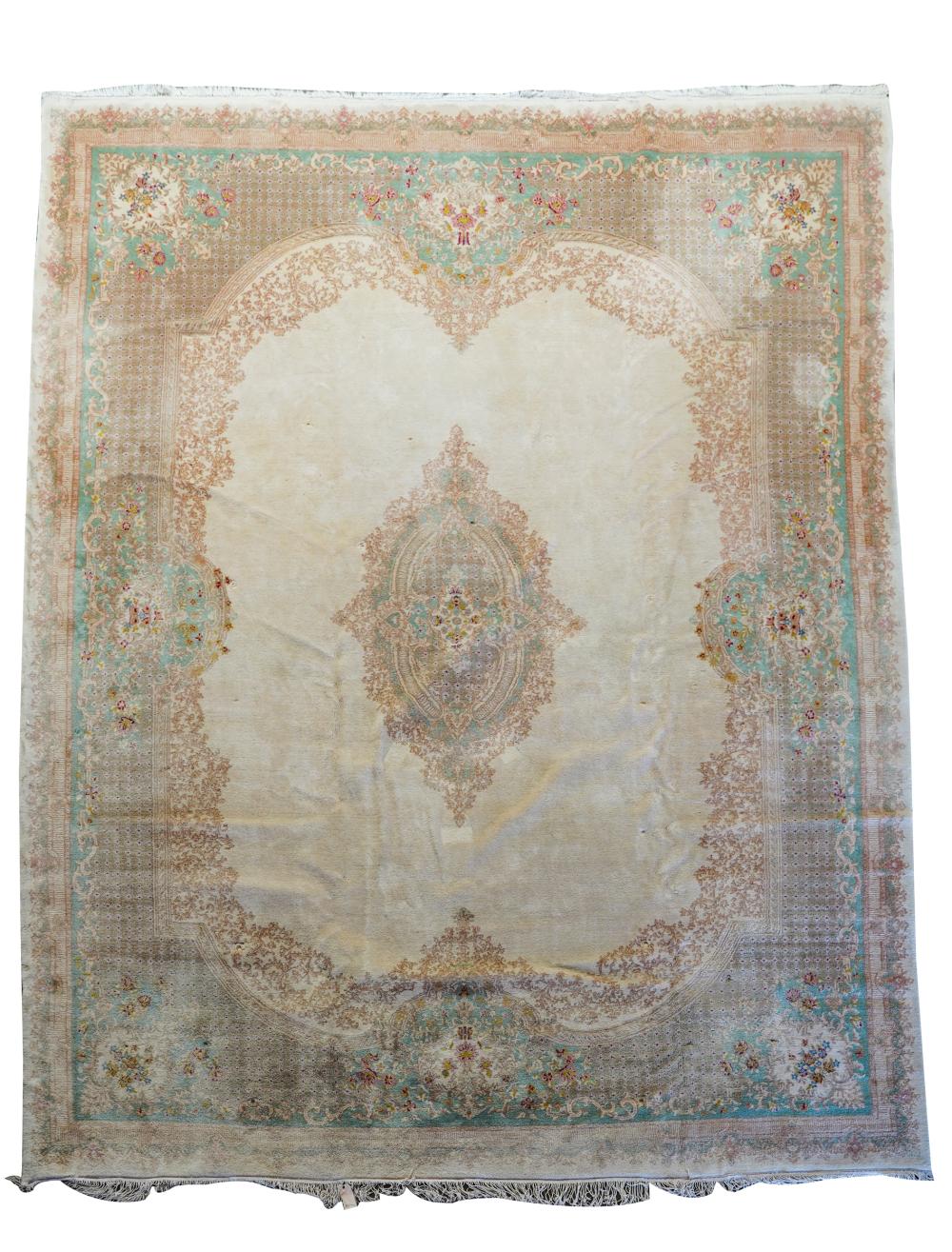 Appraisal: KERMAN CARPETwool beige field with light blue border and central