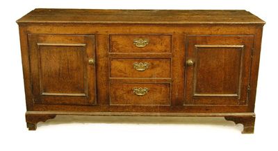 Appraisal: A George III Welsh oak dresser the boarded top above