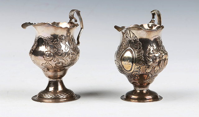 Appraisal: A GEORGE III SILVER HELMET JUG with a wavy edge