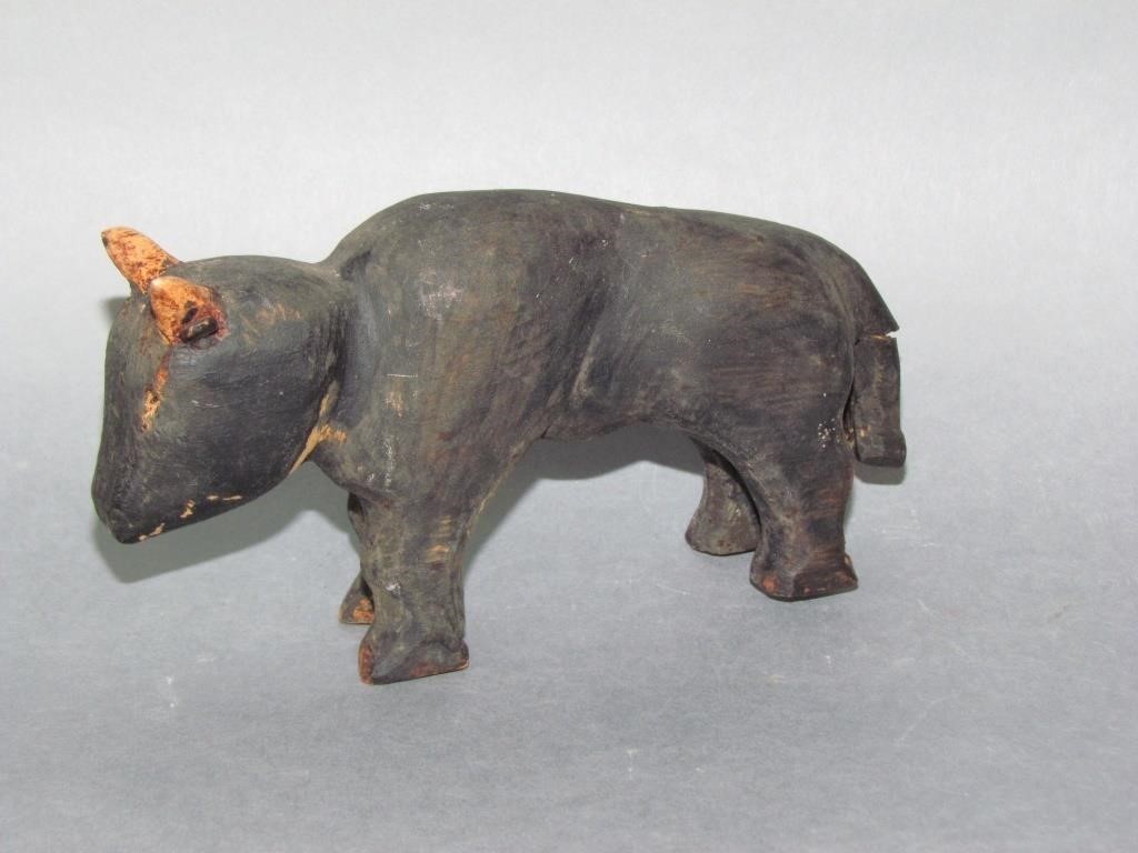 Appraisal: FOLK ART CARVED BULLblack paint broken tail minor paint loss