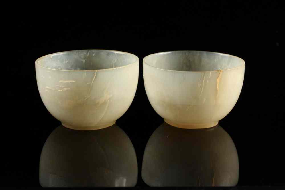 Appraisal: PAIR EARLY CHINESE JADE CUPS - Pair Ming Dynasty Footed