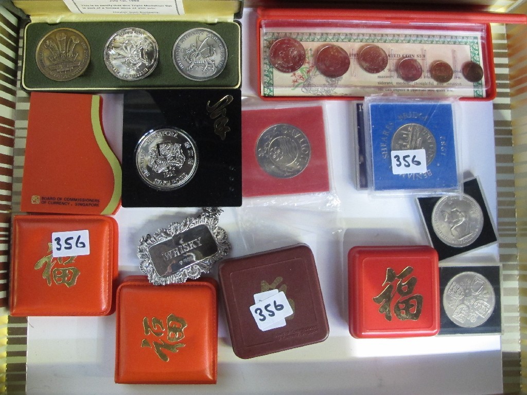 Appraisal: Box of assorted coins and a silver decanter label