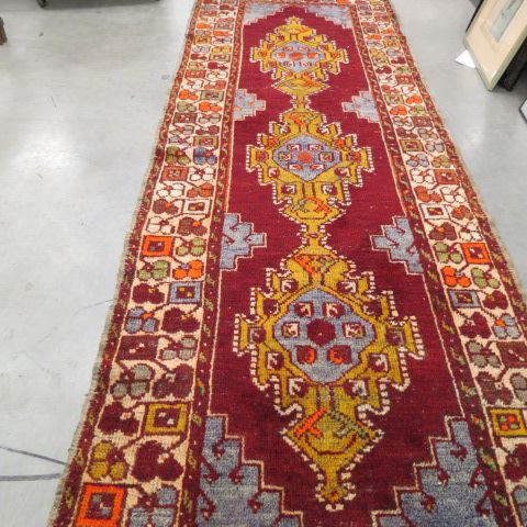 Appraisal: Oushak Persian Handmade Runner triple geometric designs red field '