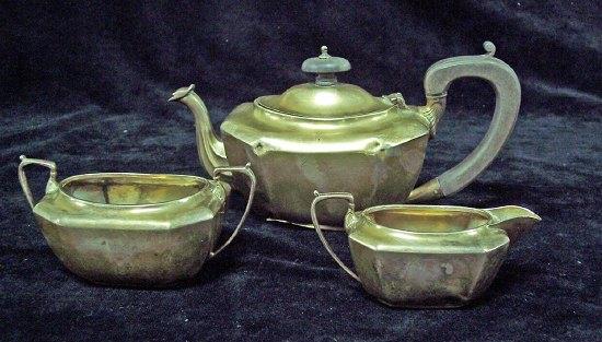 Appraisal: A bachelors three-piece tea set early th Century of canted